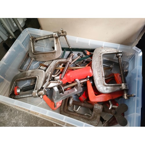 315 - Mitre saw and two boxes containing a large quantity of clamps and vice grips.