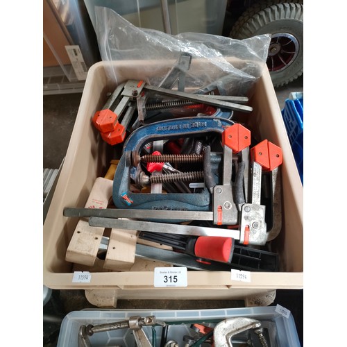 315 - Mitre saw and two boxes containing a large quantity of clamps and vice grips.