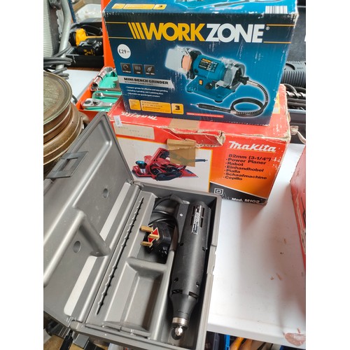 311 - Three various electrical tools to include Dremel tool. Work zone mini bench grinder and Makita 82mm ... 