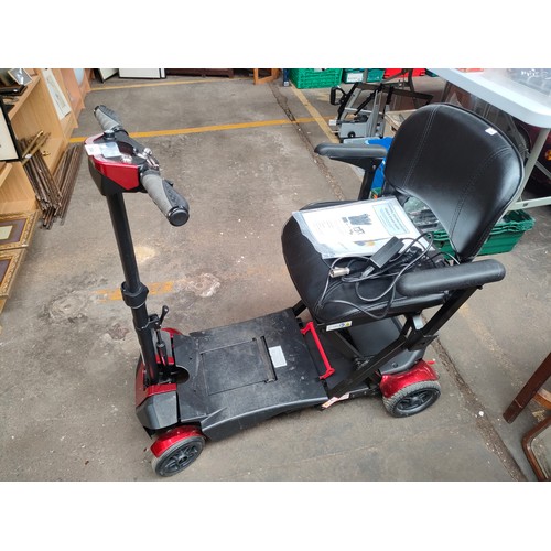 304 - Disability folding scooter, comes with key, manuals  and charger. In a working condition.