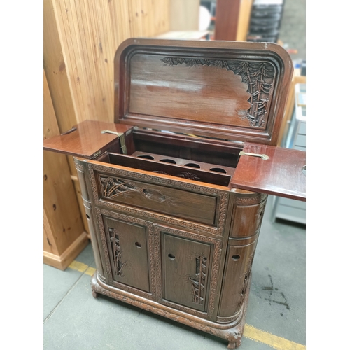 362 - A Oriental carved buffet cabinet