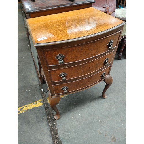 302 - 1940's 50's burr walnut three drawer side chest, supported on queen anne legs.