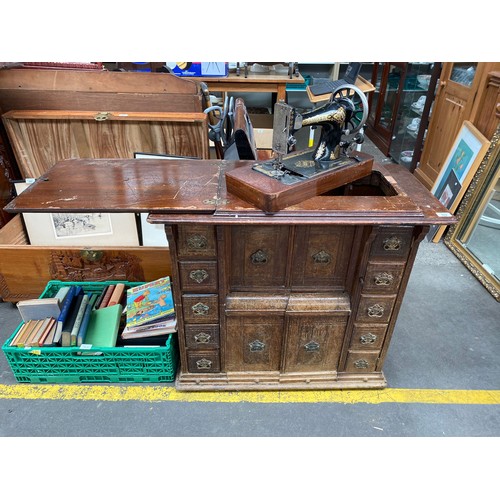 352 - Antique sewing cabinet with singer sewing machine