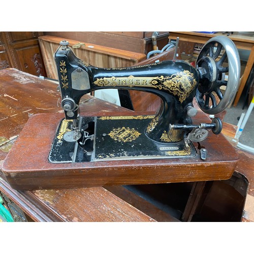 352 - Antique sewing cabinet with singer sewing machine