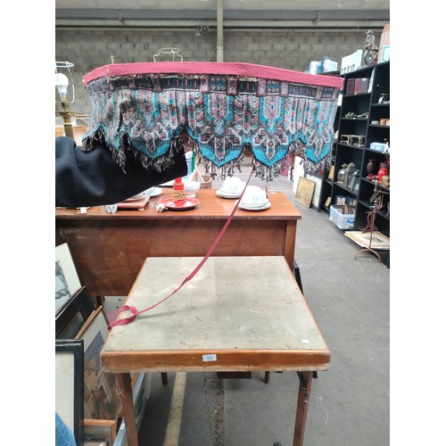 372 - Folding card table together with hexagonal table top with eastern beadwork skirt