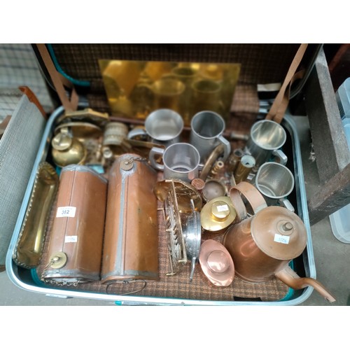 382 - Vintage suitcase containing copper and brassware to include two victorian copper water bottles, tren... 