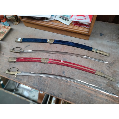 384 - Two Indian dress swords in sheaths