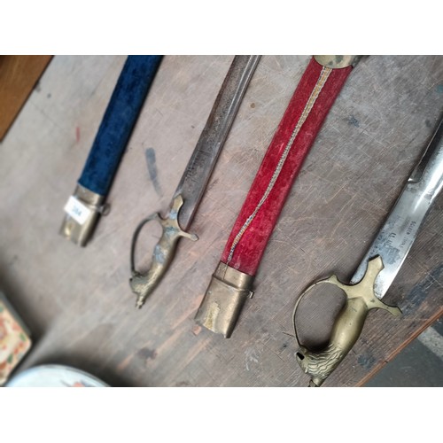 384 - Two Indian dress swords in sheaths