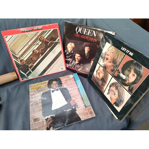 392 - A Lot of four vintage records includes The Beatles, Queen and Michael Jackson