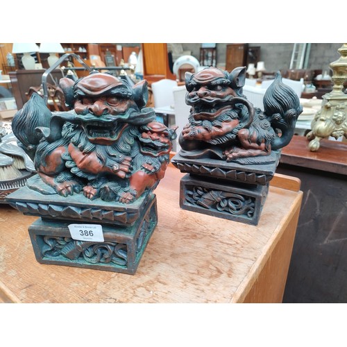 386 - Pair of oriental foo dog figures