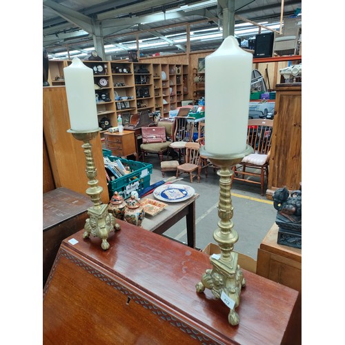 412 - Pair of 19th century heavy cast brass and ornately decorated candle holders