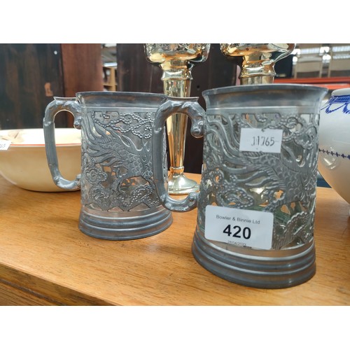 420 - A Selection of collectables includes silver plated fluted vases, vintage tankards, selection of  Gra... 