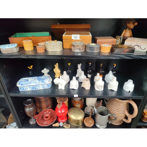 435 - Three shelves of collectables to include trinket boxes, Selection of vintage pie funnels and victori... 