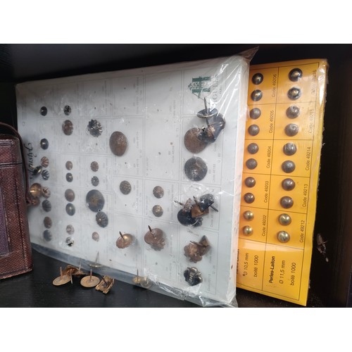 438 - Shelf of 19th century brass carriage clock cases and two sleeves of military antique uniform buttons... 