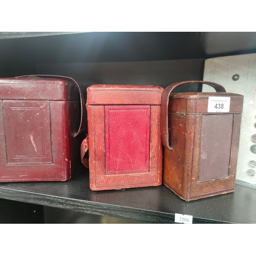 438 - Shelf of 19th century brass carriage clock cases and two sleeves of military antique uniform buttons... 