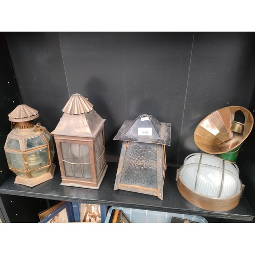 440 - Shelf of vintage copper and brass lanterns.