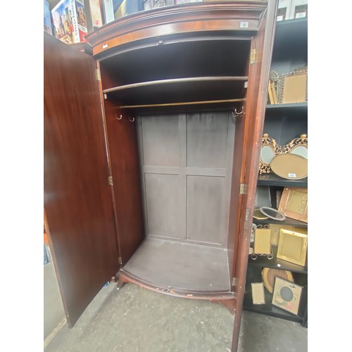 450 - Victorian bow front wardrobe.