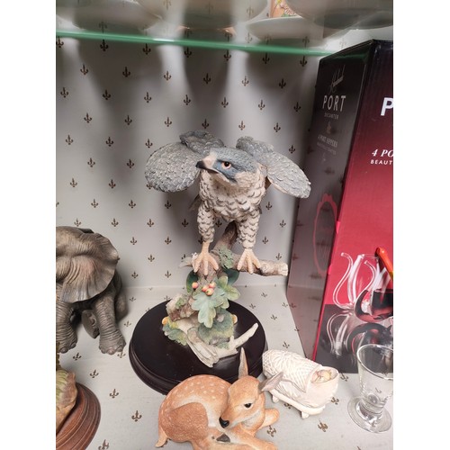 453 - Shelf of animal figures and boxed port decanter set in box.