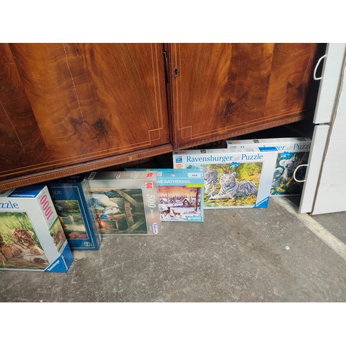 454 - Selection of boxed jig saw puzzles.