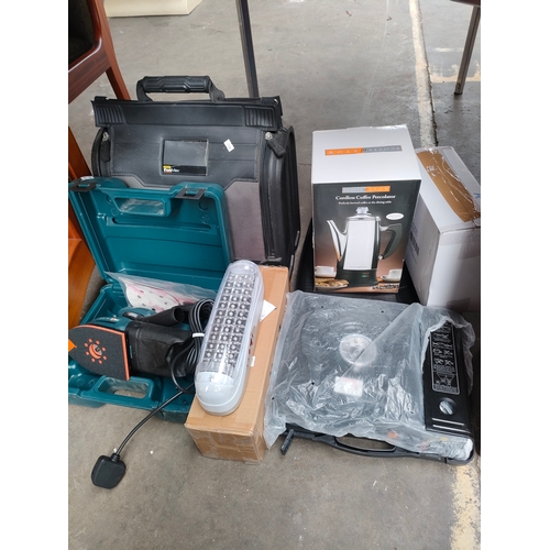 454A - A selection of boxed electricals includes black n decker sander , cordless coffee percolator, campin... 