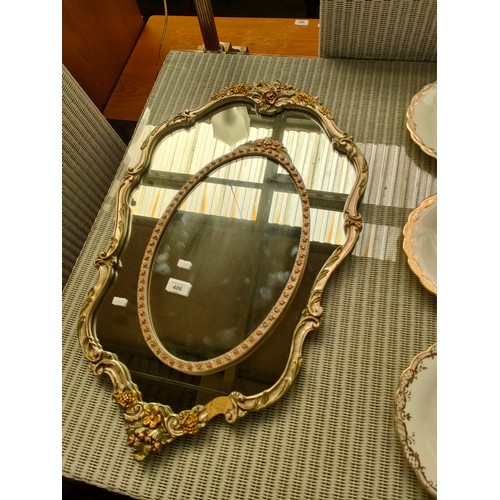 486 - Two Mid Century Atsonea floral pattern wall mirrors.