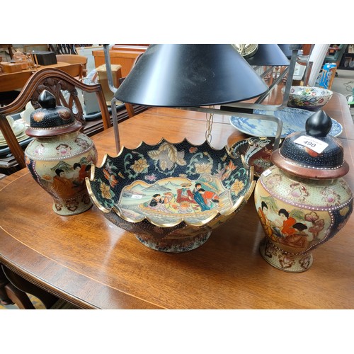 490 - Large oriental bowl and two oriental highly decorative temple jars.