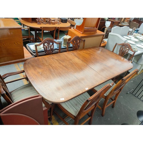 491 - Large mahogany extendable dining table with six chairs.