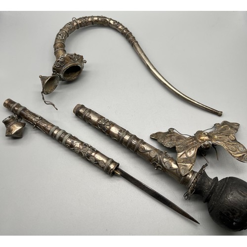 92 - A Lot of two antique foreign white metal and filigree worked smoking/ opium pipes. One pulls open to... 