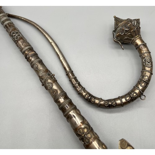 92 - A Lot of two antique foreign white metal and filigree worked smoking/ opium pipes. One pulls open to... 