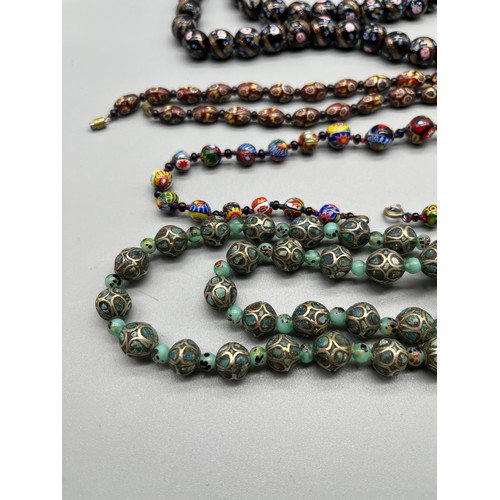 84 - A Selection of vintage Venetian art glass, art glass and metal worked bead necklaces.