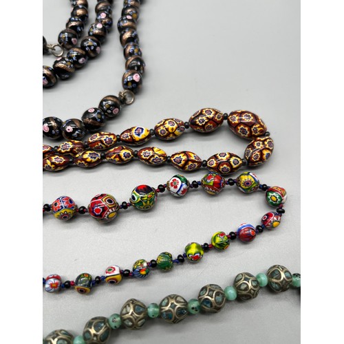 84 - A Selection of vintage Venetian art glass, art glass and metal worked bead necklaces.