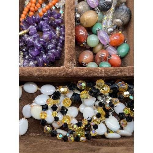 82 - A Tray of vintage necklaces. to include Malachite, Raw Amethyst bead necklace, Coral necklace and va... 