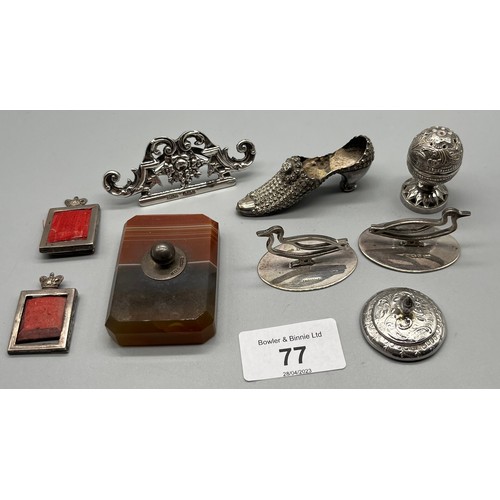 77 - A Collection of silver marked items to include agate paperweight, duck shaped card holders, pin cush... 