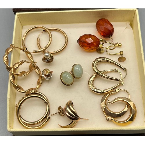 65 - Nine pairs of 9ct gold earrings. Includes 9ct and amber drop earrings, 9ct and jade earrings and var... 