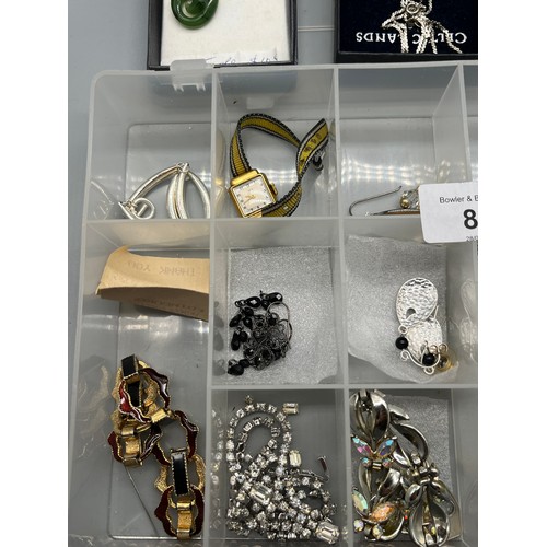 88 - A Collection of costume jewellery and silver jewellery. Includes Jade carved pendant, Silver gate br... 