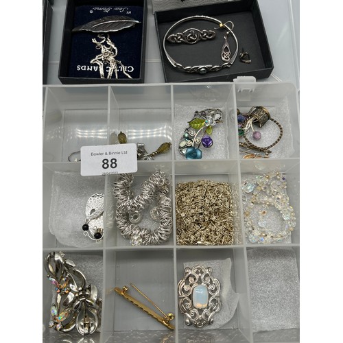 88 - A Collection of costume jewellery and silver jewellery. Includes Jade carved pendant, Silver gate br... 