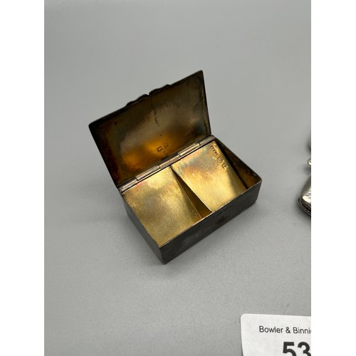 53 - Four silver items. Chester silver pill box with removable silver divider, Two Birmingham silver vest... 