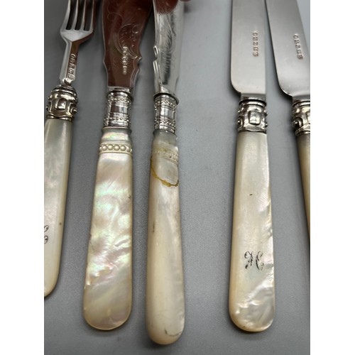 51 - A Small quantity of Silver and mother of pearl handle flatwares.