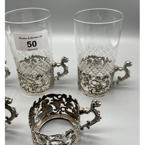 50 - A Set of 6 Birmingham silver ornate cup holders. Includes four crystal glasses. [170grams]