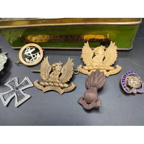 60 - A box of military cap badges