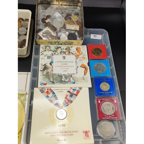 65 - Two large trays of collectable world coins and cased commemorative UK coins set