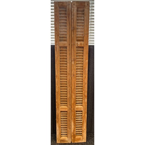 81 - A Pair of large antique pine window shutters. [207.5cm high- 46.5cm wide]