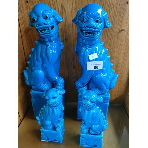 86 - 2 Pairs of Chinese turquoise blue mid century foo dog figures [One large as found]