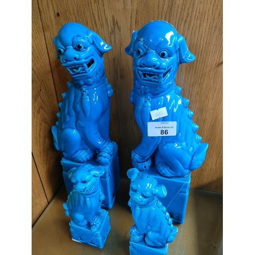 86 - 2 Pairs of Chinese turquoise blue mid century foo dog figures [One large as found]