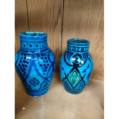 93 - Two antique Indian blue glazed vases and a pair of foo dog figures