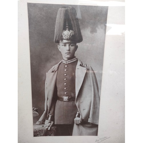 95 - Large framed photograph titled 'Q.T.S.S. Mauretania' Leaving the Tyne and an antique framed military... 