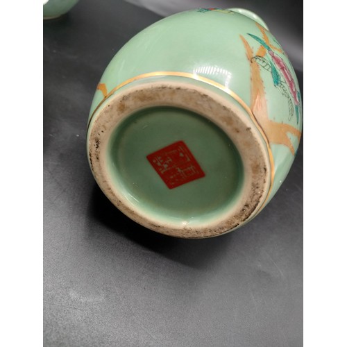 102 - A shelf of Chinese celadon ware some signed to base to include raised planter with floral decoration... 