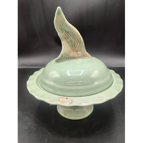 102 - A shelf of Chinese celadon ware some signed to base to include raised planter with floral decoration... 