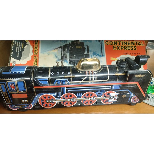 112 - A Continental Express tin plate train with original box and a tin plate Abtotpacca Russian clockwork... 