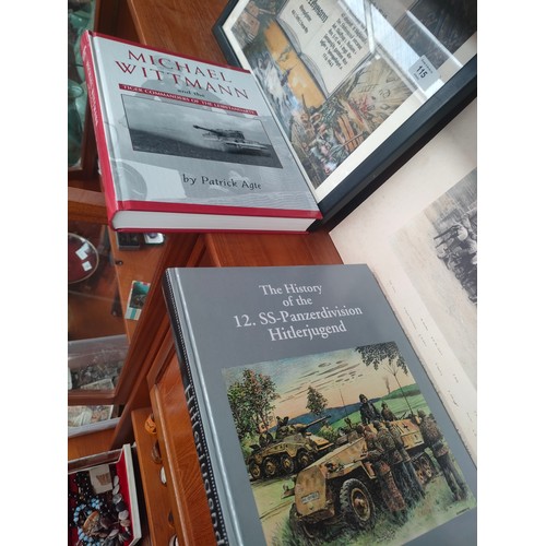 115 - A German soldiers framed service print, military photograph and two books titled Hitlerjugend and Mi... 